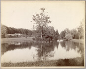 Two women and a child in a small boat on a lake near the original Guilford mansion, a home built by William McDonald after inheriting the land from his father General McDonald in 1850. Arunah S. Abell, founder of The Sun, purchased the property in 1872 and it remained in the Abell family until it…