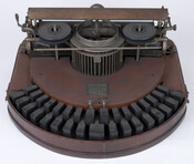 A Hammond No. 1 Typewriter with case. The Hammond Typewriter company, founded by James Bartlett Hammond (1839-1913), first sold the Hammond No. 1 in 1884. Hammond No. 1 typewriters featured innovative technologies not previously seen in typewriters, such as the Ideal (curved) keyboard, an anvil and hammer mechanism for even printing, and a type sector…
