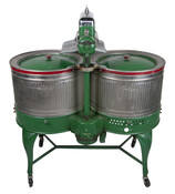 This Dexter Eastwin Washing Machine, on wheels, features two washtubs, is electrified with electric wringer at top center, and has a painted green base with red and green chrome accents. Manufactured around 1931, this machine belonged to the Mankiewicz family, who lived at 2223 East Pratt Street, Baltimore, Maryland, from the 1930s-1950s. The machine was…