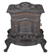 Gothic-style black cast iron wood stove standing on four feet.