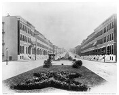 A view of the 900 block of Fulton Avenue, looking north, in Baltimore, Maryland. Victorian rowhomes, a wide median, and a horse-drawn streetcar are visible. Fulton Ave runs through West Baltimore and once served as a racial demarcation line when, in 1910, the city enacted the nation's first racial segregation zoning ordinance.