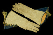 Gray Leather ladies' riding gauntlets with blue trim and green and gold cord tassels. Marked "H.W. Donnally, Glover, Lewisburg, W.Va."