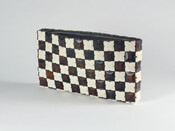 Clutch-style purse comprised of brown and white plastic blocks in a checkerboard pattern, held together with strips of brown plastic. Zipper at top closure. Purse lined with dark brown rayon with small pocket inside.