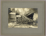 A damaged structure following a storm and flooding in Tolchester, Maryland. The building is missing its roof and has been hit by fallen trees. Tolchester was the site of the Tolchester Beach Amusement Park, which consisted of a bathing beach, amusement park, racetrack, and hotel, and was in operation from 1877 to 1962. The Kent…