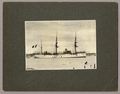 Side view of a naval vessel flying an Italian flag in the Inner Harbor of Baltimore, Maryland.