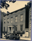 An exterior view of the Dulin House at 107 West Monument Street, between Cathedral Street and Park Avenue, in Baltimore, Maryland. The house was later converted into an apartment building.