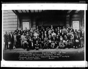 Group portrait of Flournoy Miller, Aubrey Lyles, Noble Sissle, Eubie Blake, and company. The caption beneath the group reads, "Miller and Lyles, Sissle and Blake and their All-Around the World Company in their musical knock out 'Shuffle Along' now playing at the Selwyn Theatre, Boston."