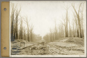 View looking south along the 4200 and 100 blocks of Charlcote Road during the Roland Park Company’s development of the Guilford neighborhood in Baltimore, Maryland. The Highfield Road crossing at center is hidden by the slope of Charlcote Road.