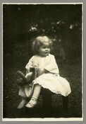 Portrait of Baltimore, Maryland, photographer Emily Spencer Hayden's daughter Anna Bradford Hayden, nicknamed "Nan," with a teddy bear. Verso transcription: Anna Bradford Hayden (Agle)