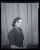 Juanita Jackson Mitchell (1913-1992) is pictured seated in front of a curtain. Mitchell was an educator, civil rights activist, and lawyer. Mitchell taught in Baltimore high schools and founded the Baltimore City-Wide Young People's Forum in 1931, and the National Association for the Advancement of Colored People (NAACP) Youth Movement in 1935. She was the…