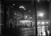 Street-level night view of the Auditorium Theater and Music Hall, located at 506 North Howard Street, near Franklin Street in Baltimore, Maryland. The first building on this site opened as The Natatorium in 1880 and was purchased by James L Kernan (1838-1912) in 1892. It was reopened as a vaudeville theater in 1903 and by…