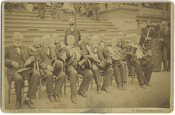 Group portrait of veterans from the War of 1812. The veterans were known as the Old Defenders of the Battle of Baltimore, which occurred on September 12, 1814. The group of men is seated before a set of stairs at the Mansion House in Druid Hill Park, Baltimore, Maryland, and each holds a top hat…